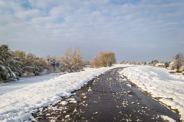 Panorama of the frozen lake and snow-covered trees
