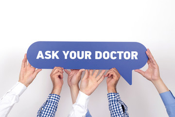 Group of people holding the ASK YOUR DOCTOR written speech bubble