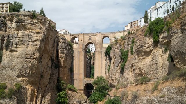 Beautiful timelapse view of Puente Nuevo bridge over Tajo Gorge in Ronda with tilt up camera motion, Andalusia, Spain