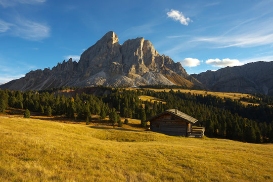 Small hut with a mountain on background, Dolomites, Italy