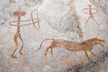 A scene of animal hunting performed ocher on the wall of the cave. Ancient people. stone Age....