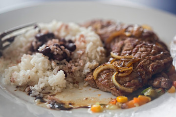 Beef with rice and beans, vegetables. Cuban dish