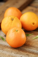 Fresh ripe oranges on the wooden table