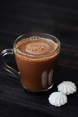 Delicious thick hot chocolate with meringue on the table 