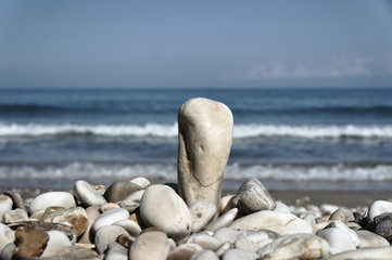 Fototapeta na wymiar Stones and pebbles on the beach on the Greek island of Corfu.
