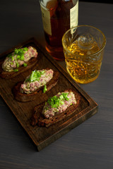 bruschetta, on slices of toasted baguette garnished with basil