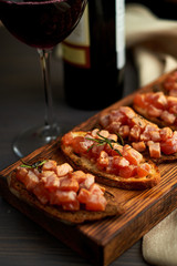 bruschetta with delicious fish on a cream cushion with capers and olive oil
