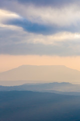 Landscape photo mountain layer and sunlight at sunset Phu kradueng national park , Thailand