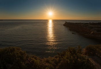 The red ibiza creek at dawn, Balearic Islands.