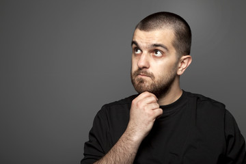 Young Man Thinking Studio Shoots On Gray