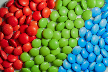 Fototapeta na wymiar Closeup chocolate candies in the RGB color