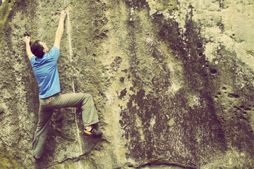Obraz premium Climber to climb a big wall.