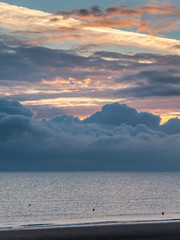 Sunrise with low clouds on Omaha Beach Normandy France