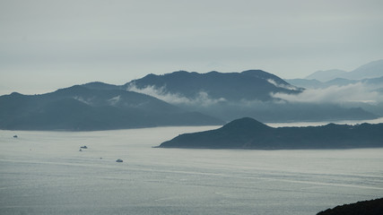 Aerial view of cargo ship heading in bay