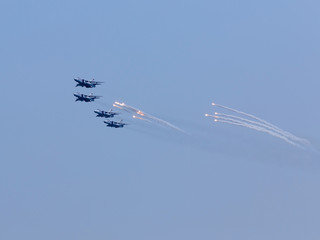 Four war jet planes in sky