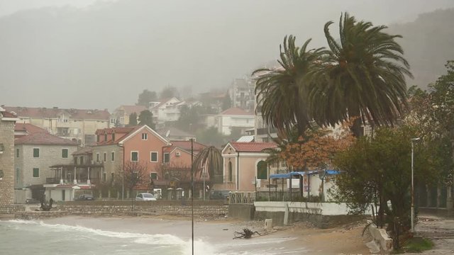 Storm on the sea. Embankment of the coastal city. 