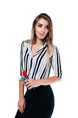 beautiful girl make-up artist with beautiful hair in a striped shirt on a white background in whose hands tassels and other makeup accessories