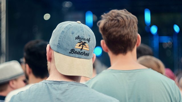 two men in a festival crowd 