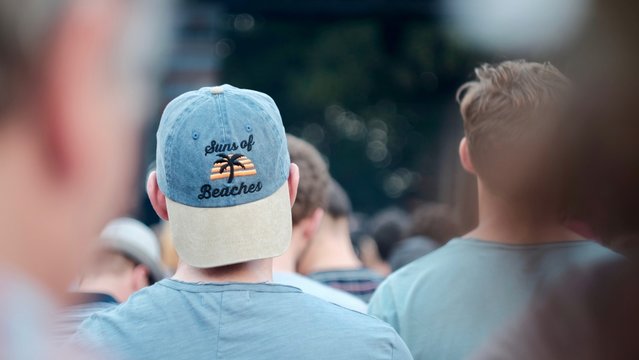two men in a festival crowd 