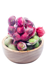 Closeup of Manila tamarind on wood cup isolated white background