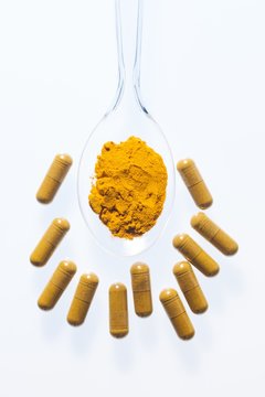 Turmeric supplement capsules and powder
