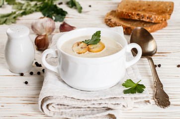 Gourmet cream soup with mushrooms (champignons), parsley and croutons