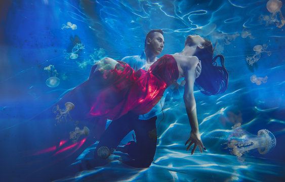 Couple dreamlike situation underwater