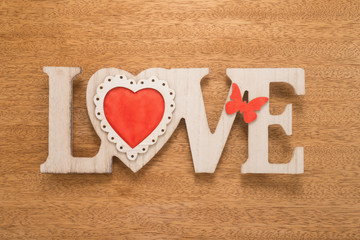 Love sign on wooden background 