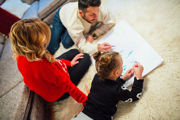Family coloring together at home