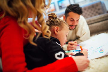 Family coloring together at home