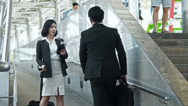 Asian young businessman has route guidance to pretty woman