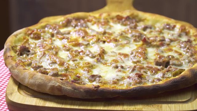 Turkish and Arabic Traditional Baked Ramadan Food Pide or Pizza ingredients with sliced halal lamb meat , butter, cheese and spicy herbs. Rotating shot. Copy space for text area.