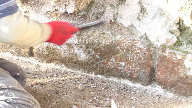 Restoration work in Temple for wall