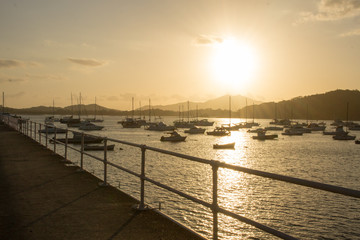 Fototapeta premium Ocean sunset landscape with small boats