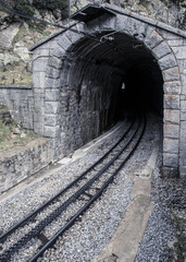 Fototapeta na wymiar Old tunnel train of The Vall de Nuria Rack Railway. It is a mountain railway in the Pyrenees exit in Vall de Nuria