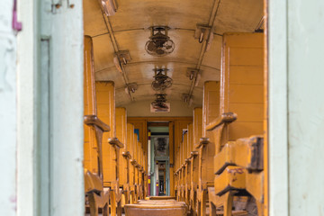 Fototapeta na wymiar Inside of railway train with seats vintage style