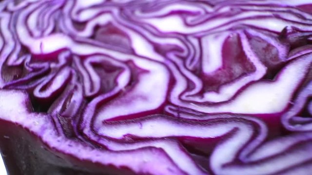 The texture of red cabbage closeup. Smooth camera motion. Cutting.