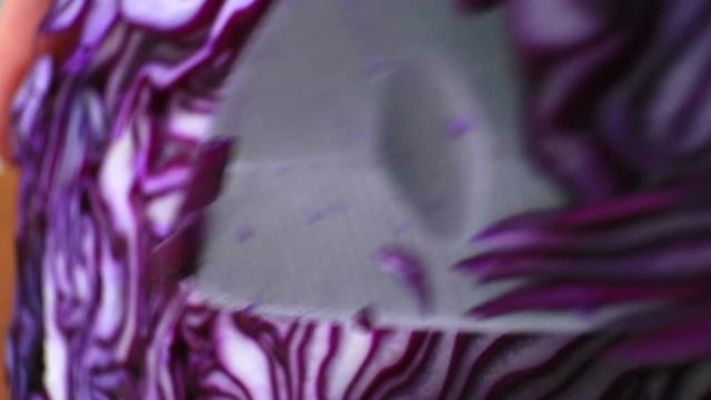 The texture of red cabbage closeup. Smooth camera motion. Cutting.