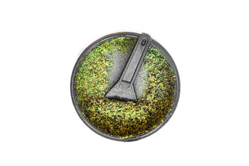 Kief in grinder for weed Trichomes buds of Cannabis macro top view isolated on white background
