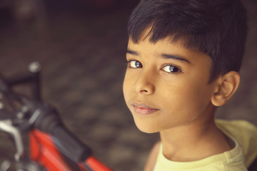 Indian Little Boy with Cycle