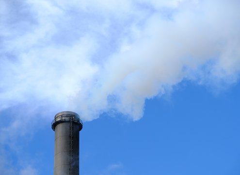 smoking chimney with blue sky