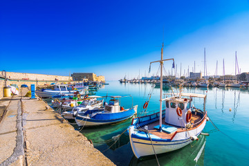 Fototapeta na wymiar Heraklion harbour with old venetian fort Koule and shipyards, Crete, Greece