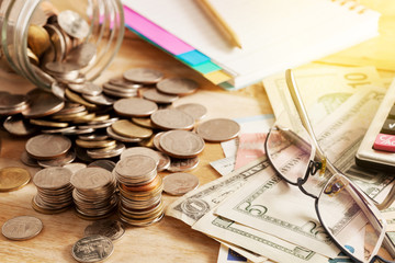 coins and dollar banknote,concept business planning and finance and savings.