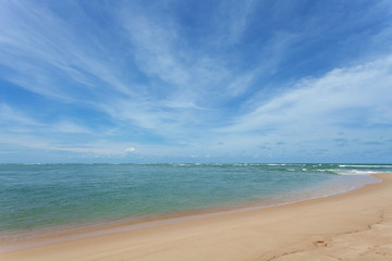 Seascape scenery view of beautiful beach and sky with wave crashing on sandy shore in phuket thailand.