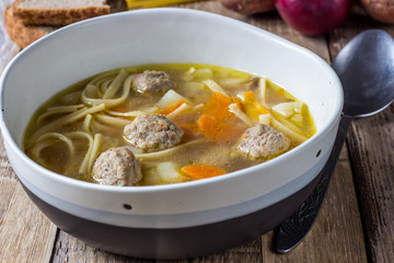 Soup with meatballs and noodles