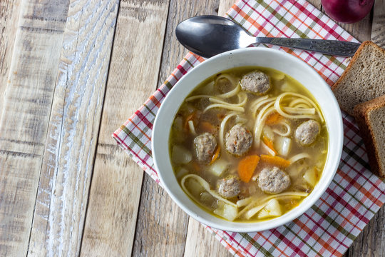 Soup with meatballs and noodles