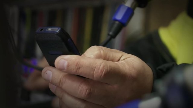 Man Using Old Mobile Phone Texting Vintage Cellphone