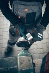 Metallurgy heavy industry. Factory for production of heavy pellet stoves and boilers. Worker hands close up. 