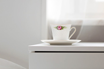 Cup of beverage on the cupboard