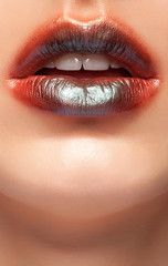 Fototapeta premium Close up photo of lips with glossy lipstick on them. Beauty image